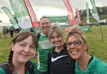 Lyn Corkish, Nicole Milton, Kasey Saunders and James Riley complete a 26 mile hike from Alwick to Bamburgh Casle in aid of Macmillan