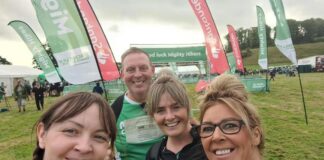Lyn Corkish, Nicole Milton, Kasey Saunders and James Riley complete a 26 mile hike from Alwick to Bamburgh Casle in aid of Macmillan