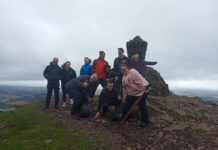 The Neurology Team at Forth Valley Royal Hospital brave the elements to scale Dumyat hill