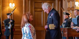 Lynne Rowley, NHS Forth Valley Orthotics Team Lead, is presented with her MBE by HRH King Charles III