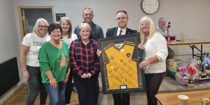 The framed football shirt helped raise much need fund for the community garden