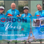 Friends holding banner