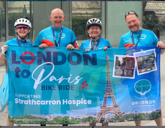 Friends holding banner